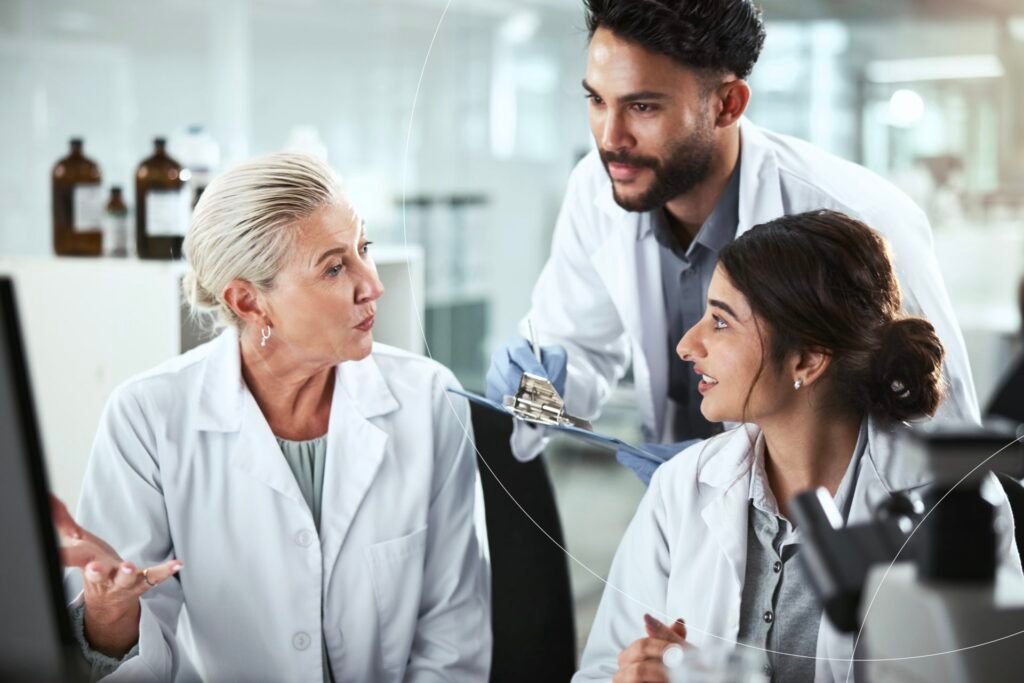 Clinical experts reviewing study data and discussing safety findings in a research setting
