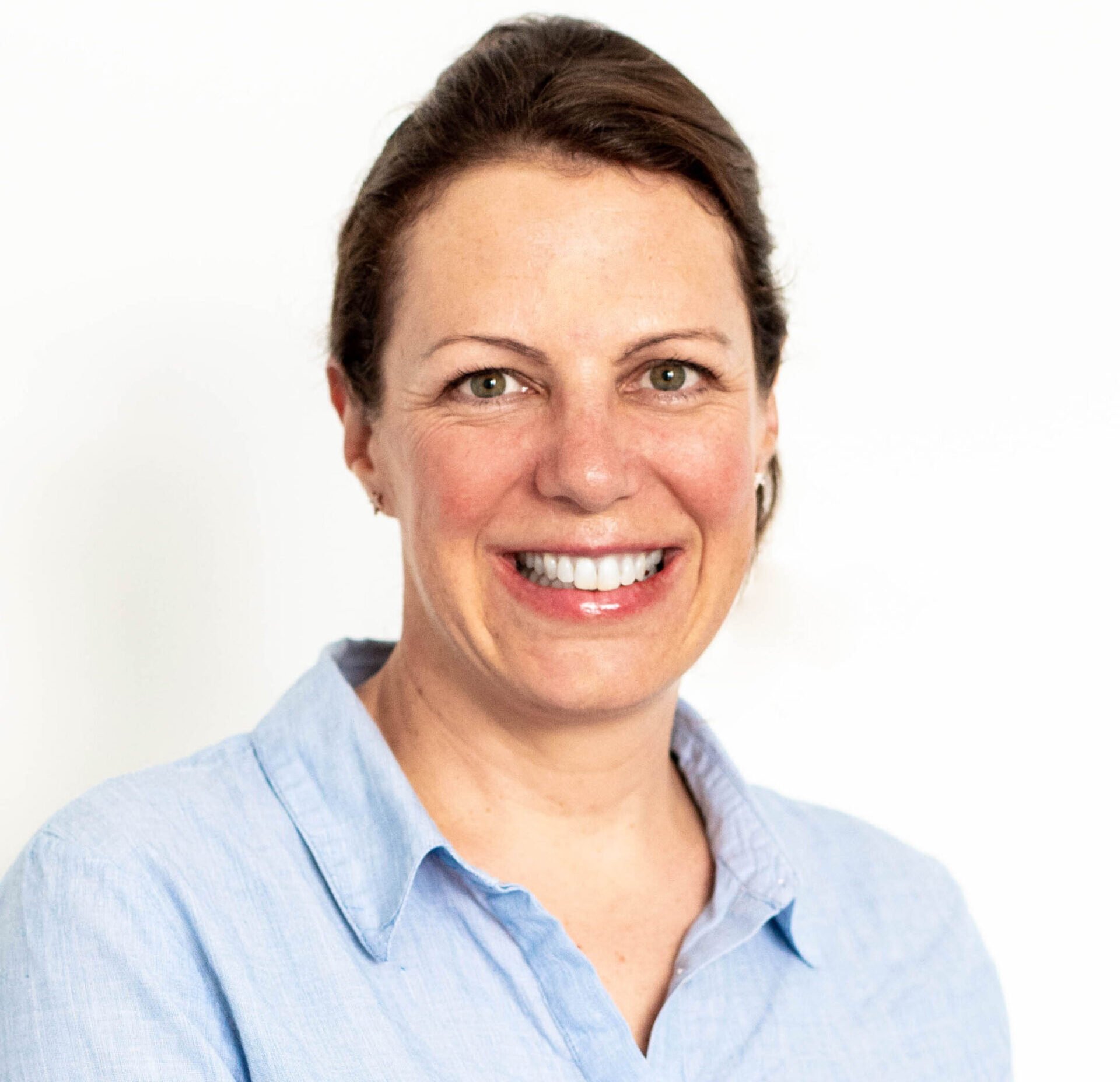 Portrait of Angelika Gaufer, a marketing executive at SCIRENT, speaking during an interview.